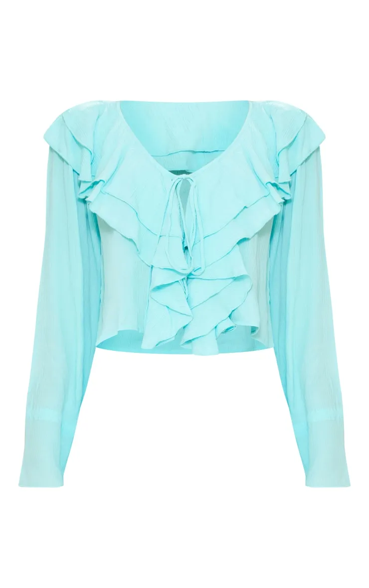 Blouse fluide en étamine turquoise à bordure volantée